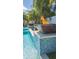 Fire and water features in a modern pool design at 1110 2Nd S Ave, Tierra Verde, FL 33715