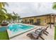 Resort-style pool with a covered patio and plenty of seating at 1110 2Nd S Ave, Tierra Verde, FL 33715