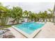 Inviting pool area with lounge chairs and tropical landscaping at 1110 2Nd S Ave, Tierra Verde, FL 33715