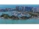 Aerial view of waterfront property, showcasing a luxury highrise building and marina at 1111 N Gulfstream Ave # 3E, Sarasota, FL 34236