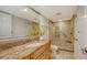 Bathroom with granite vanity and walk-in shower at 1111 N Gulfstream Ave # 3E, Sarasota, FL 34236