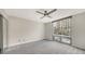 Bedroom with large window and ceiling fan at 1111 N Gulfstream Ave # 3E, Sarasota, FL 34236