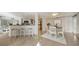 Open dining area with kitchen views and seating for four at 1111 N Gulfstream Ave # 3E, Sarasota, FL 34236