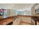 Modern kitchen with granite countertops and stainless steel appliances at 1111 N Gulfstream Ave # 3E, Sarasota, FL 34236