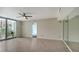 Spacious living room with tile flooring and access to a private balcony at 1111 N Gulfstream Ave # 3E, Sarasota, FL 34236