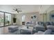 Bright living room with comfy seating and access to a balcony at 1111 N Gulfstream Ave # 3E, Sarasota, FL 34236