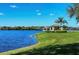 Lakefront view with gazebo and lush grass at 11808 Crawford Parrish Ln, Parrish, FL 34219