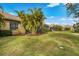 Landscaped backyard with spacious lawn and privacy at 12199 Sebring Ln, Venice, FL 34293