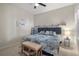 Bright bedroom featuring a king-size bed and beach-themed decor at 12199 Sebring Ln, Venice, FL 34293