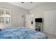 Spacious bedroom with a comfortable bed and built in shelving at 12199 Sebring Ln, Venice, FL 34293
