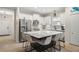 Eat-in kitchen with a large island, stainless steel appliances, and marble countertops at 12199 Sebring Ln, Venice, FL 34293