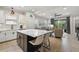 Open concept kitchen with large island and breakfast bar, overlooking living room at 12199 Sebring Ln, Venice, FL 34293