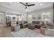 Open living space featuring a sectional sofa and adjacent kitchen at 12199 Sebring Ln, Venice, FL 34293