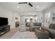 Open concept living room with a view of the kitchen and access to the backyard at 12199 Sebring Ln, Venice, FL 34293