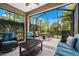 Relaxing screened patio with outdoor furniture and grill at 12199 Sebring Ln, Venice, FL 34293