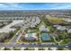 Aerial view of community with pool, tennis courts, and lake at 12240 Whisper Lake Dr, Bradenton, FL 34211