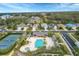 Community pool and tennis courts with surrounding homes at 12240 Whisper Lake Dr, Bradenton, FL 34211