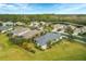 Aerial view of home with neighborhood and pond visible at 12240 Whisper Lake Dr, Bradenton, FL 34211