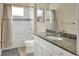 Clean bathroom with white vanity, granite countertop, and bathtub at 12240 Whisper Lake Dr, Bradenton, FL 34211