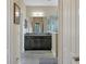 Modern bathroom with dark vanity, granite countertop, and large mirror at 12240 Whisper Lake Dr, Bradenton, FL 34211