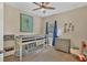 bedroom with twin bed, dresser, and giraffe art at 12240 Whisper Lake Dr, Bradenton, FL 34211