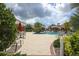 Relaxing pool area with lounge chairs and umbrellas at 12240 Whisper Lake Dr, Bradenton, FL 34211