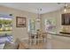 Casual dining area with table and chairs, adjacent to kitchen and backyard at 12240 Whisper Lake Dr, Bradenton, FL 34211