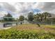 Dog park featuring agility equipment and shaded seating at 12240 Whisper Lake Dr, Bradenton, FL 34211