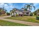Single-story house with a two-car garage and manicured lawn at 12240 Whisper Lake Dr, Bradenton, FL 34211