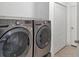 Laundry room with LG washer and dryer, and extra storage at 12240 Whisper Lake Dr, Bradenton, FL 34211