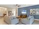 Bright and airy living room with comfortable seating and a stylish accent wall at 12240 Whisper Lake Dr, Bradenton, FL 34211