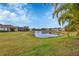 Scenic pond view from backyard, overlooking other homes at 12240 Whisper Lake Dr, Bradenton, FL 34211