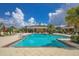 Community pool and cabana with seating and umbrellas at 12240 Whisper Lake Dr, Bradenton, FL 34211