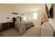 Main bedroom with a king-size bed, contemporary furniture, and neutral color scheme at 13029 Cedar Elm Lane, Parrish, FL 34219