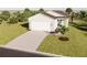 Single-story home with attached garage, landscaping, and neutral color palette at 13029 Cedar Elm Lane, Parrish, FL 34219
