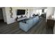 Spacious living room showcasing a sectional sofa, open floor plan, and modern decor at 13029 Cedar Elm Lane, Parrish, FL 34219