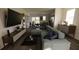 Open living space with light teal sectional sofa and a view into the kitchen at 13029 Cedar Elm Lane, Parrish, FL 34219