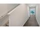 Bright entryway with stairs, dark flooring, and view to living area at 13115 Cedar Elm Lane, Parrish, FL 34219