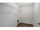 Laundry room with white wire shelving and a pet door at 13115 Cedar Elm Lane, Parrish, FL 34219