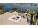 Aerial view showing house, private dock, and waterfront location at 144 N Casey Key Rd, Osprey, FL 34229