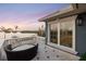 Private balcony overlooking the water with seating area; perfect for relaxation at 144 N Casey Key Rd, Osprey, FL 34229