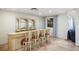 Detailed view of the basement bar with unique cabinetry at 144 N Casey Key Rd, Osprey, FL 34229