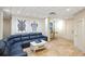 Basement lounge area with sectional sofa and coffee table at 144 N Casey Key Rd, Osprey, FL 34229