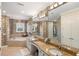 Spa-like bathroom with a soaking tub and double vanity at 144 N Casey Key Rd, Osprey, FL 34229