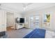 Bedroom with private balcony and water views at 144 N Casey Key Rd, Osprey, FL 34229