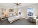Bright bedroom with king-size bed and ocean view at 144 N Casey Key Rd, Osprey, FL 34229