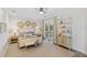 Light and airy bedroom with a king-size bed and private balcony access at 144 N Casey Key Rd, Osprey, FL 34229
