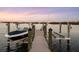 Private boat dock with lift, perfect for water access at 144 N Casey Key Rd, Osprey, FL 34229