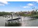 Private boat dock with lift, perfect for water access at 144 N Casey Key Rd, Osprey, FL 34229