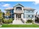 Grand waterfront home with elegant stone and blue exterior at 144 N Casey Key Rd, Osprey, FL 34229